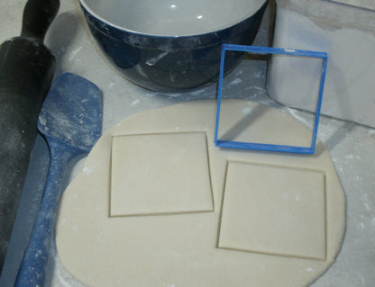 square shape cookie cutter with dough cut outs