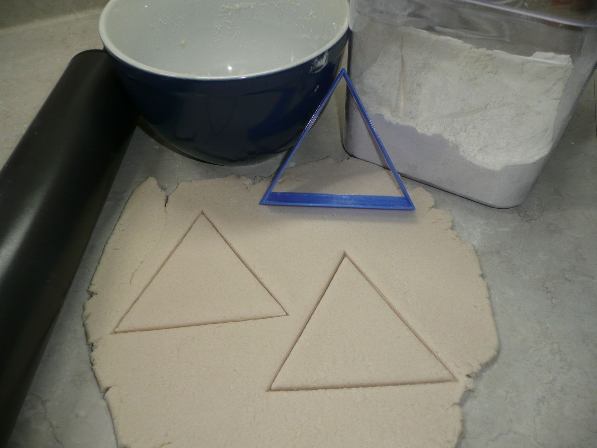 equilateral triangle cookie cutter with dough cut outs